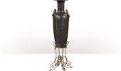 A large verdigris brass and brass engraved vase on stand