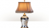 A silvered and hand painted verre églomisé table lamp