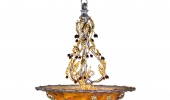 Gold chandelier in amber berry dome